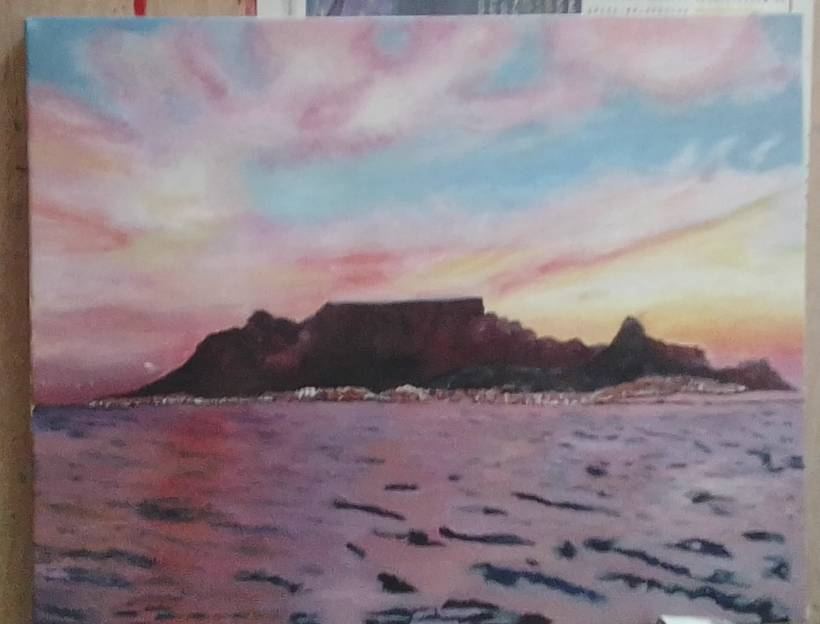 A pink-sky painting of Table Mountain at sunset