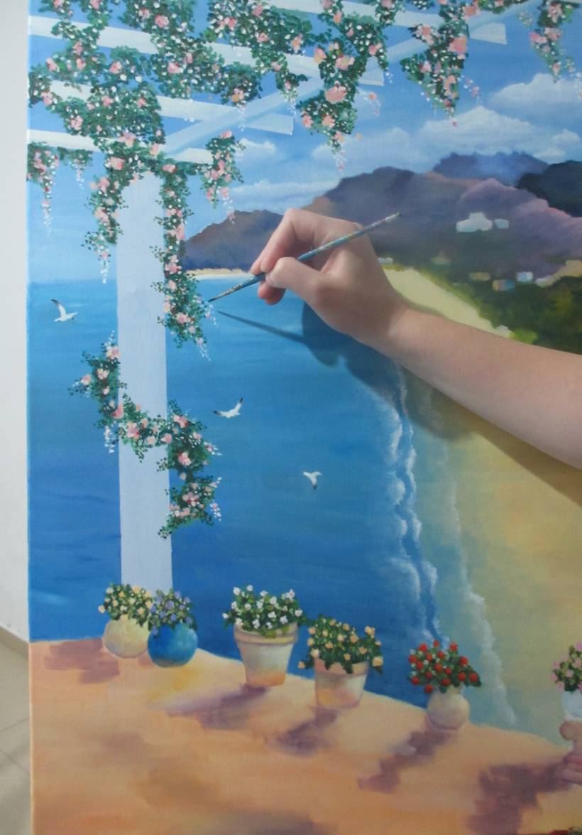 A Mediterranean terrace and sea view being painted by hand