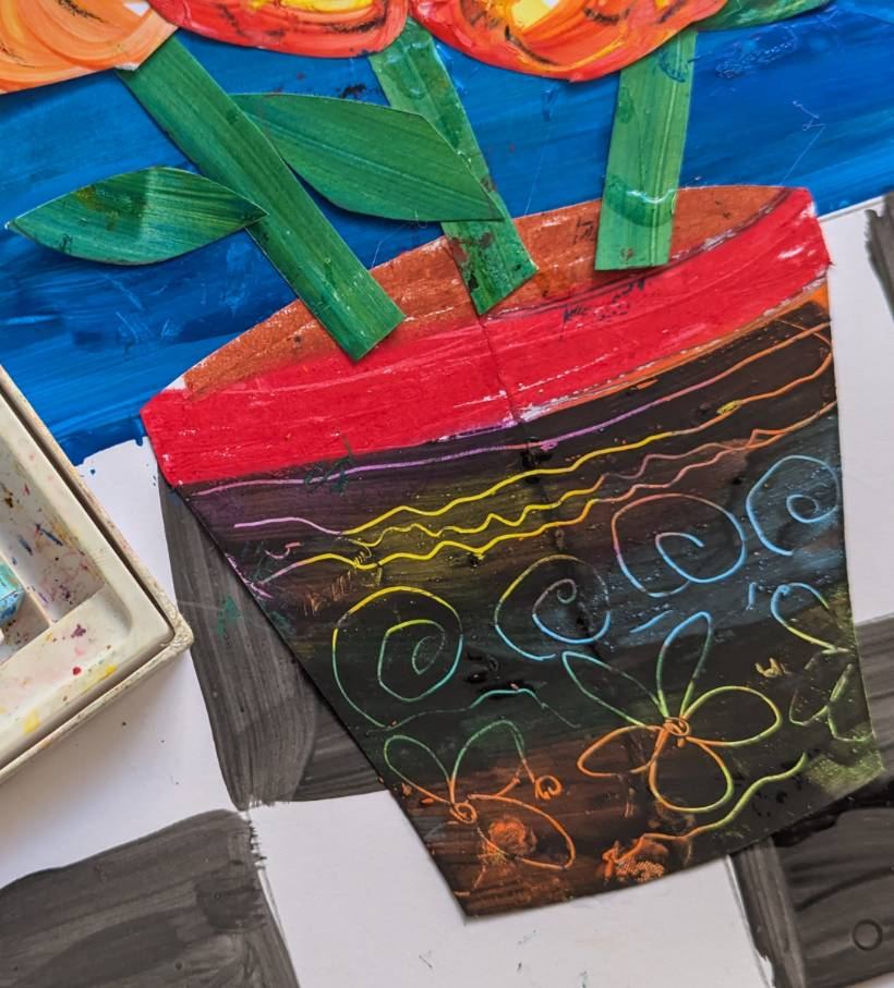 A scratch-art flowerpot collage with painted orange flowers