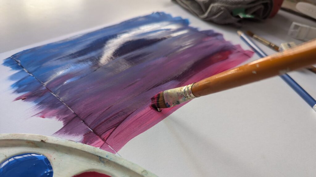 Art student practicing color mixing theory instead of following a step-by-step tutorial