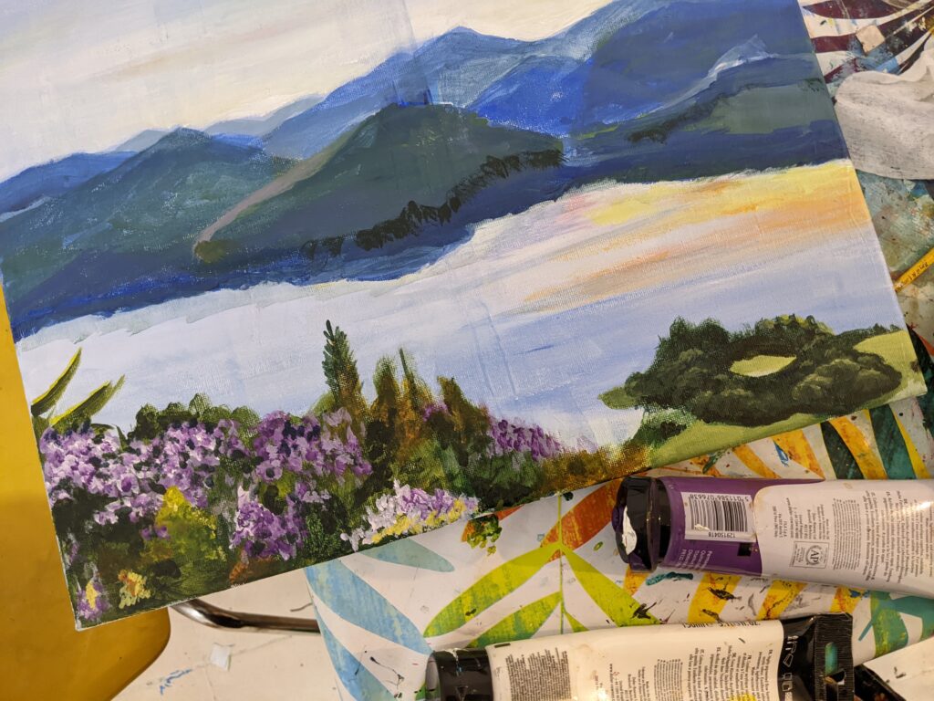 Artist working through the messy middle phase of a painting
