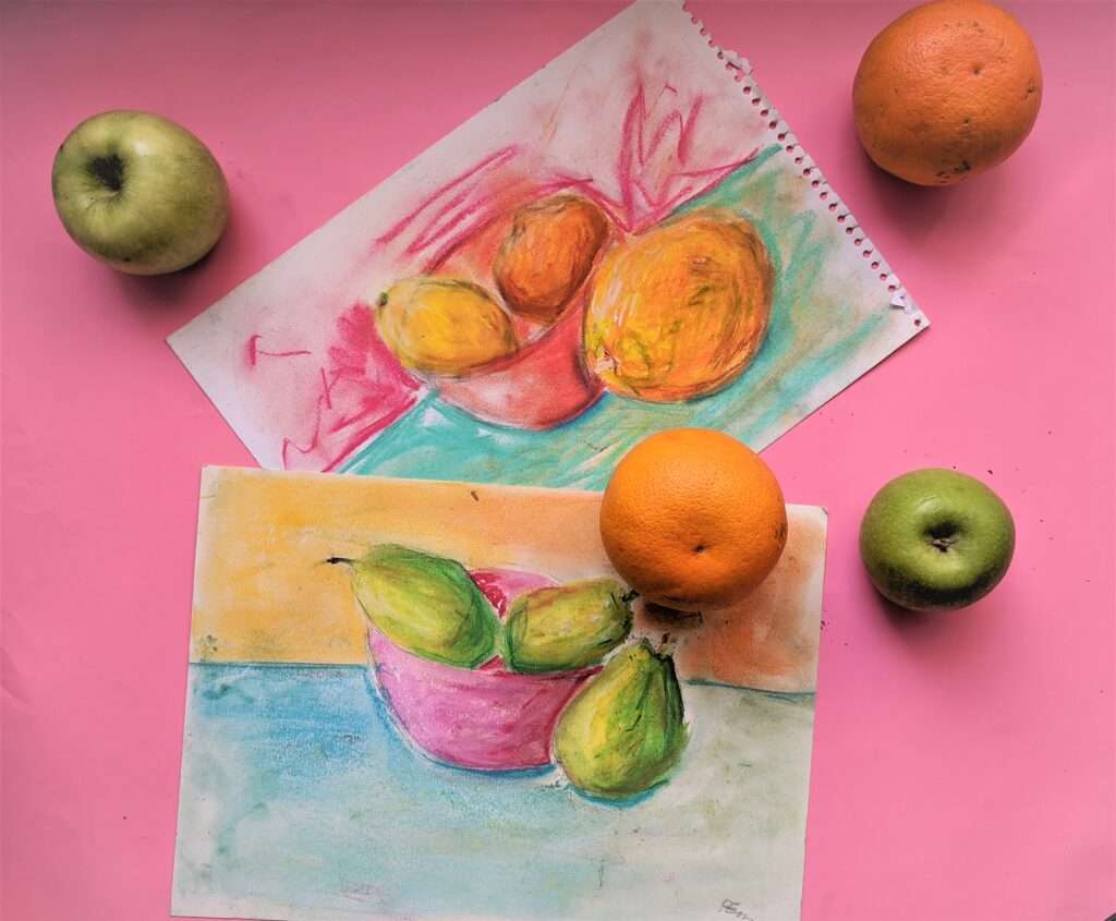 Young child painting at an easel during a beginner art class